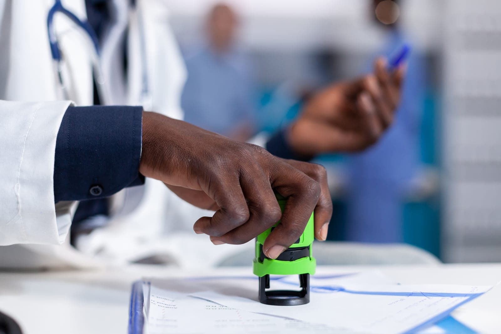 A resident doctor verifying their identity before voting